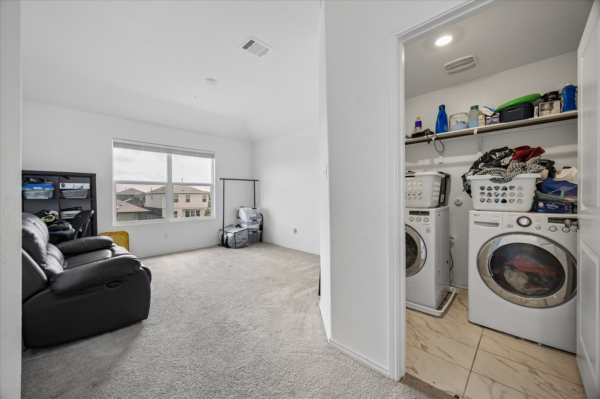 217 Canley Loop Hutto, TX 78634 - Photo 30 of 36 Functional laundry facilities seamlessly integrate within this bright, versatile living space.