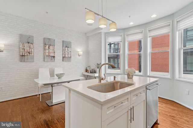 a kitchen with a stove and a refrigerator