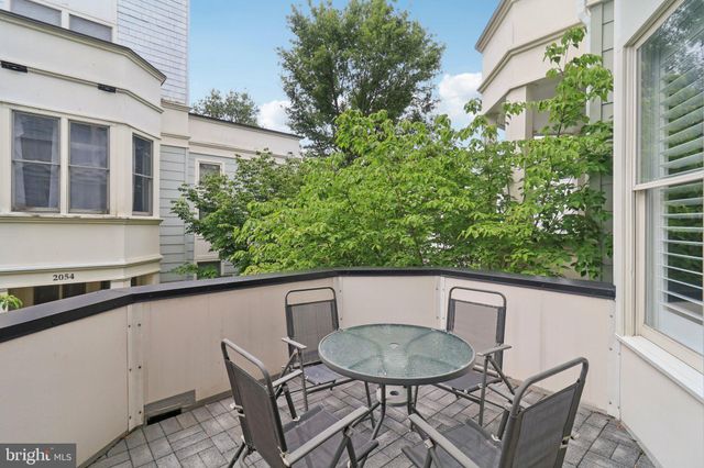 a bathroom with a sink a mirror and vanity