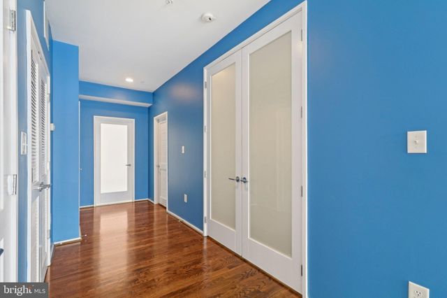 a bathroom with a granite countertop tub sink and mirror