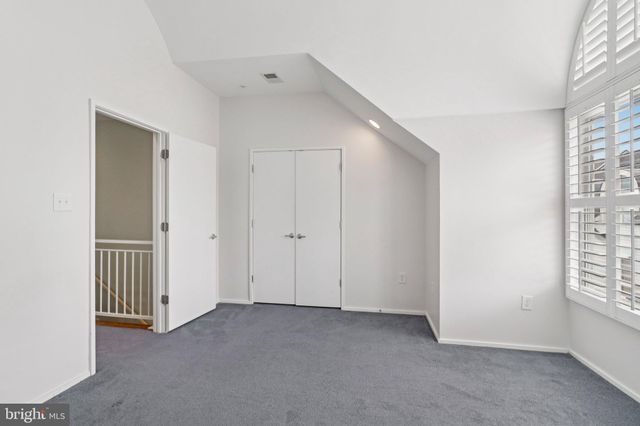 a living room with furniture and white walls