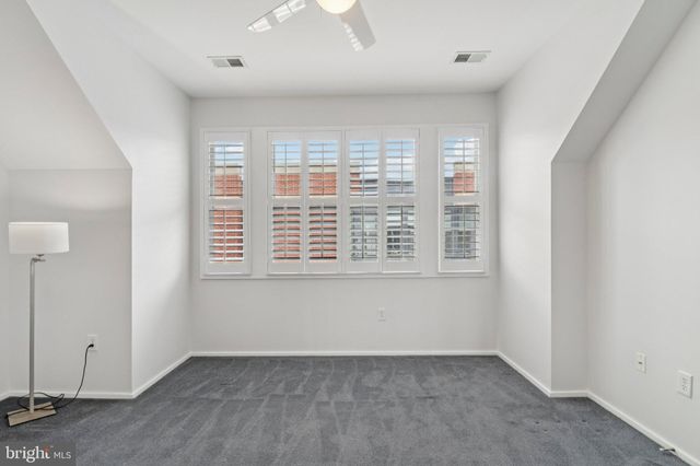 a bathroom with a sink a mirror a glass door and shower