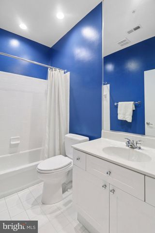 a view of a house with more windows and a road