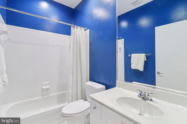 a view of a brick house with a large windows