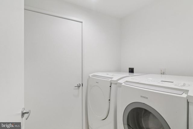 a view of a chair and tables in the patio of the house
