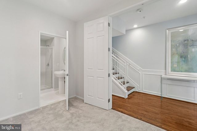 a picture of a bench in front of a wall