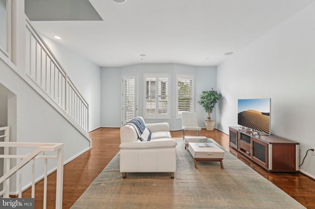 a bedroom with furniture and a potted plant