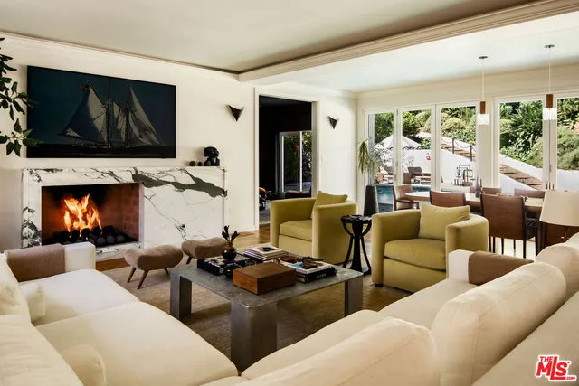 a living room with furniture fireplace and a flat screen tv