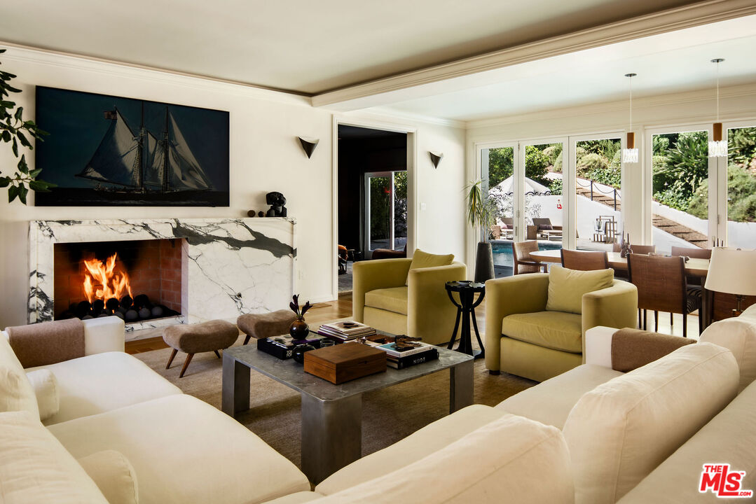 a living room with furniture fireplace and a flat screen tv