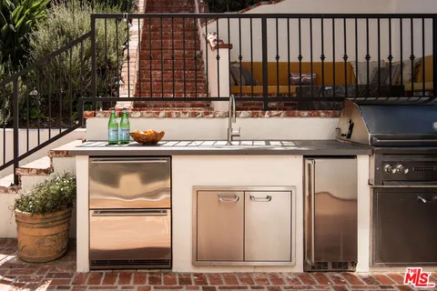 a kitchen with a sink and a refrigerator