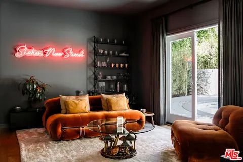 a bedroom with furniture and a window