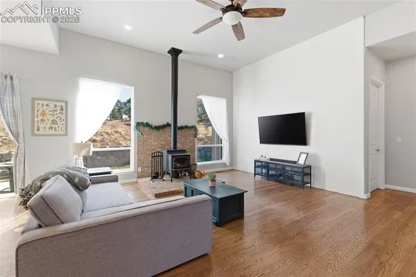 a living room with furniture and kitchen view