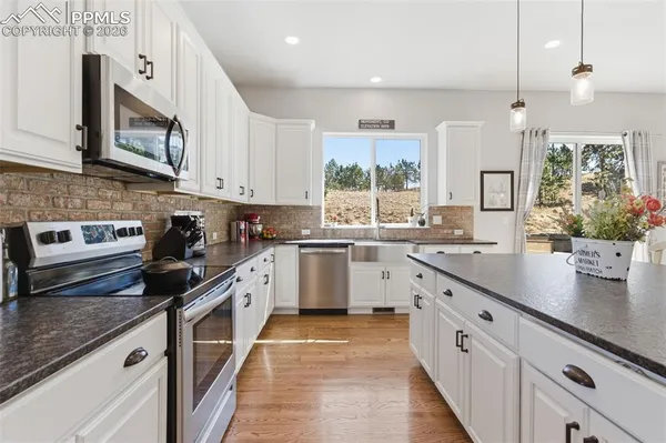 a cabinet with storage and utility room