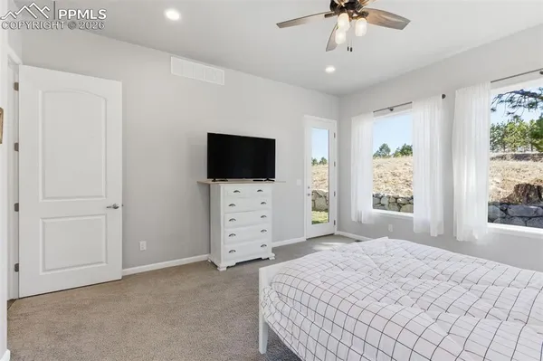 a spacious bathroom with a double vanity sink a mirror and a shower