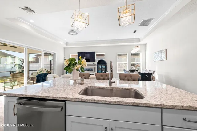 a kitchen with a sink and a counter space