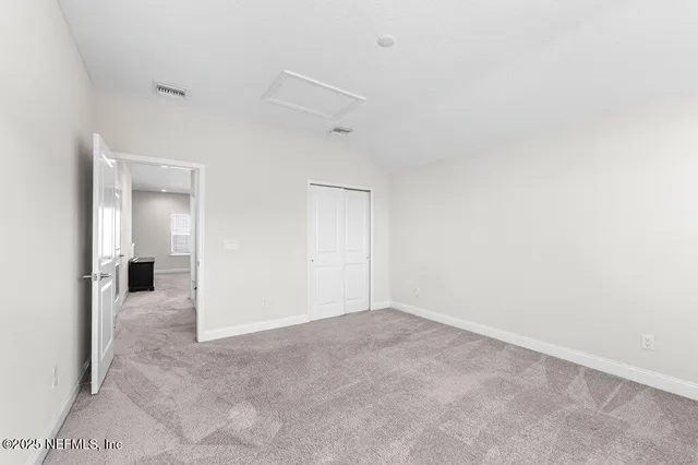 an empty room with a bathroom