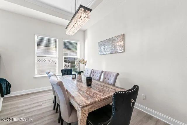 a view of a dining room with furniture window and outside view