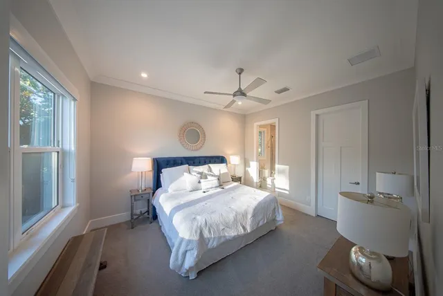 a bathroom with a bathtub a double vanity sink and a large mirror