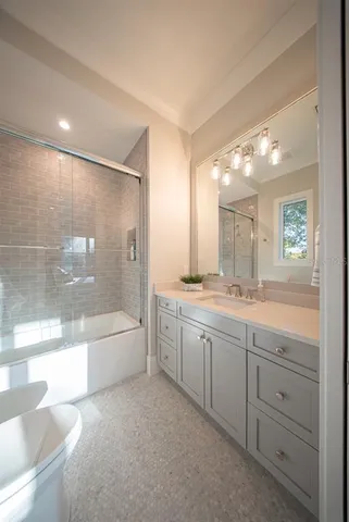 a dining room with furniture and a window