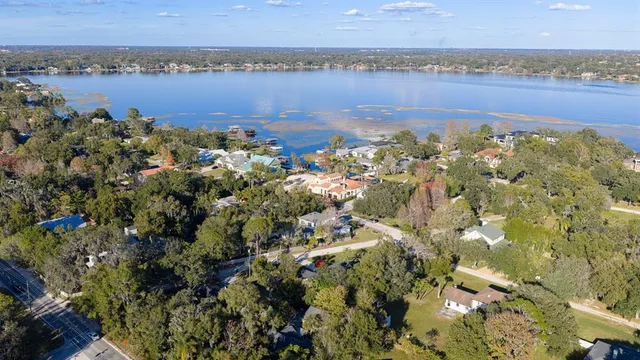 an aerial view of a house with yard swimming pool and outdoor seating