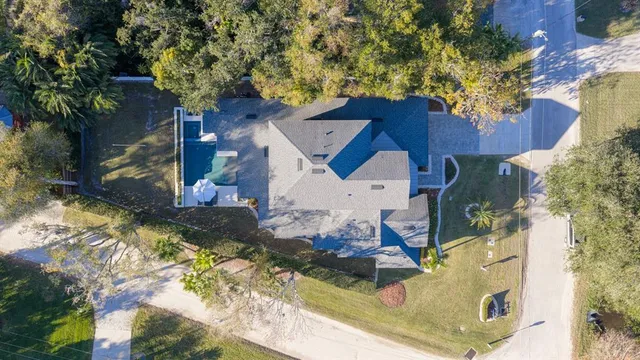an aerial view of houses with yard