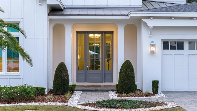 a hallway with windows and wooden floor