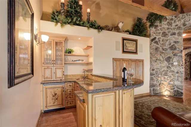 a kitchen with stainless steel appliances granite countertop a sink and cabinets