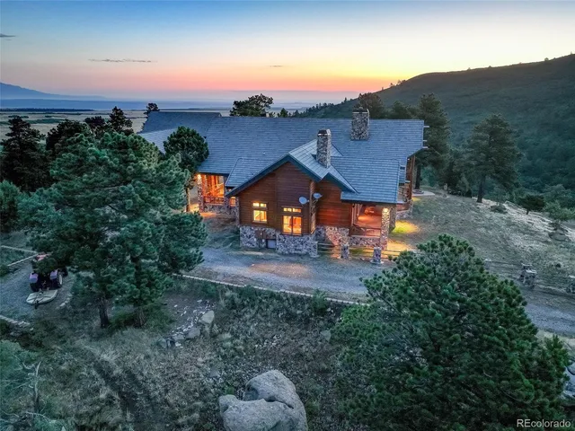 an aerial view of a house with mountain view
