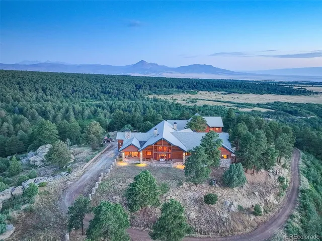 an aerial view of a house with mountain view