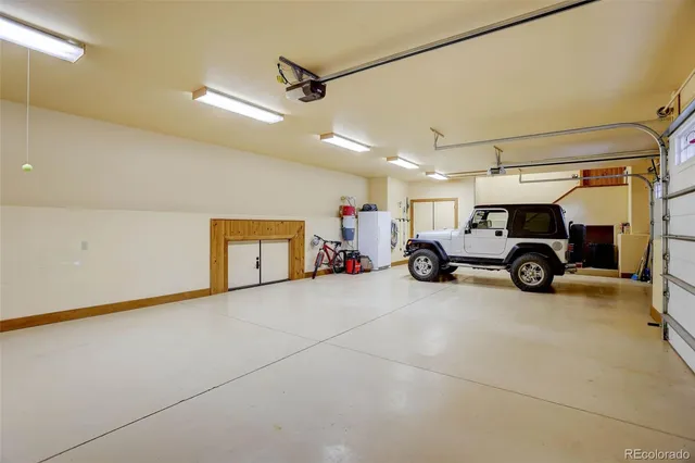 a view of parking garage with cars