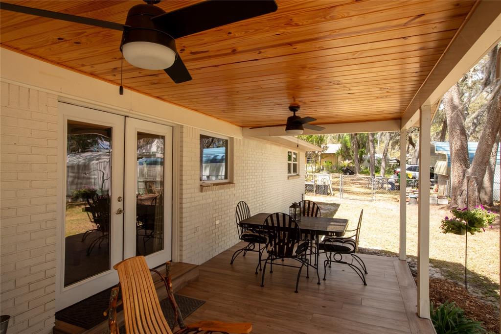 5921 County Road 352 Keystone Heights, FL 32656 - Photo 23 of 73 a view of a dining room with furniture and wooden floor