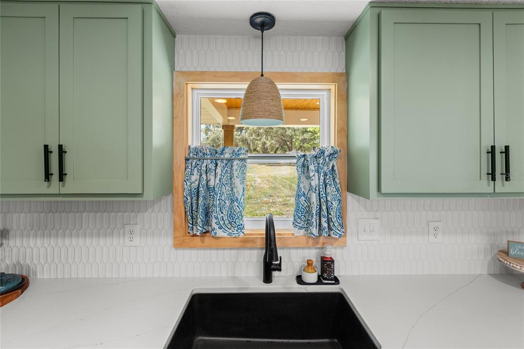 5921 County Road 352 Keystone Heights, FL 32656 - Photo 34 of 73 a bathroom with a sink and a window