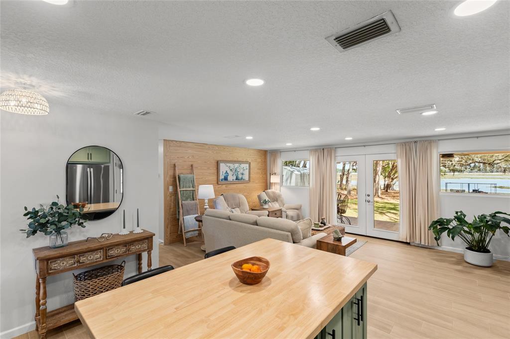 5921 County Road 352 Keystone Heights, FL 32656 - Photo 35 of 73 a living room with furniture a potted plant and a table
