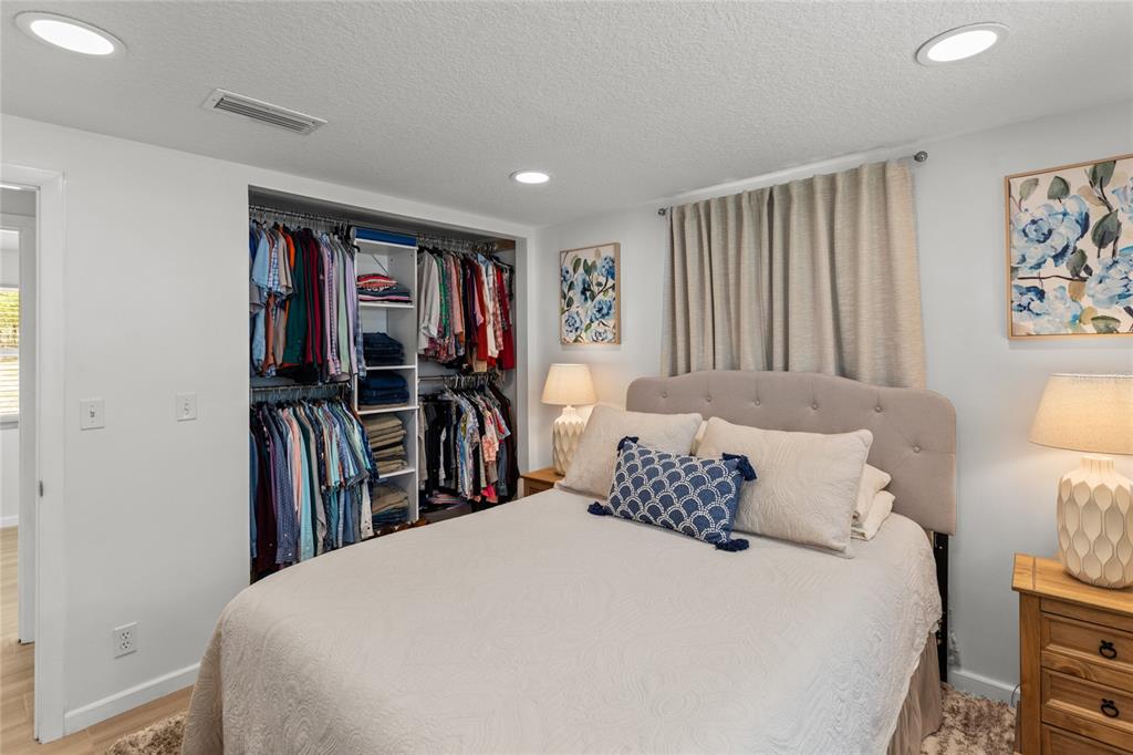 5921 County Road 352 Keystone Heights, FL 32656 - Photo 57 of 73 a bedroom with a bed and a large mirror