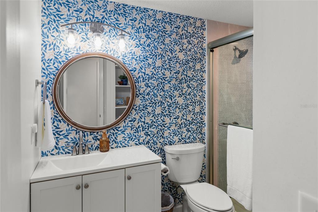 5921 County Road 352 Keystone Heights, FL 32656 - Photo 59 of 73 a bathroom with a toilet sink and mirror