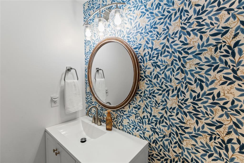 5921 County Road 352 Keystone Heights, FL 32656 - Photo 62 of 73 a bathroom with a sink and a mirror