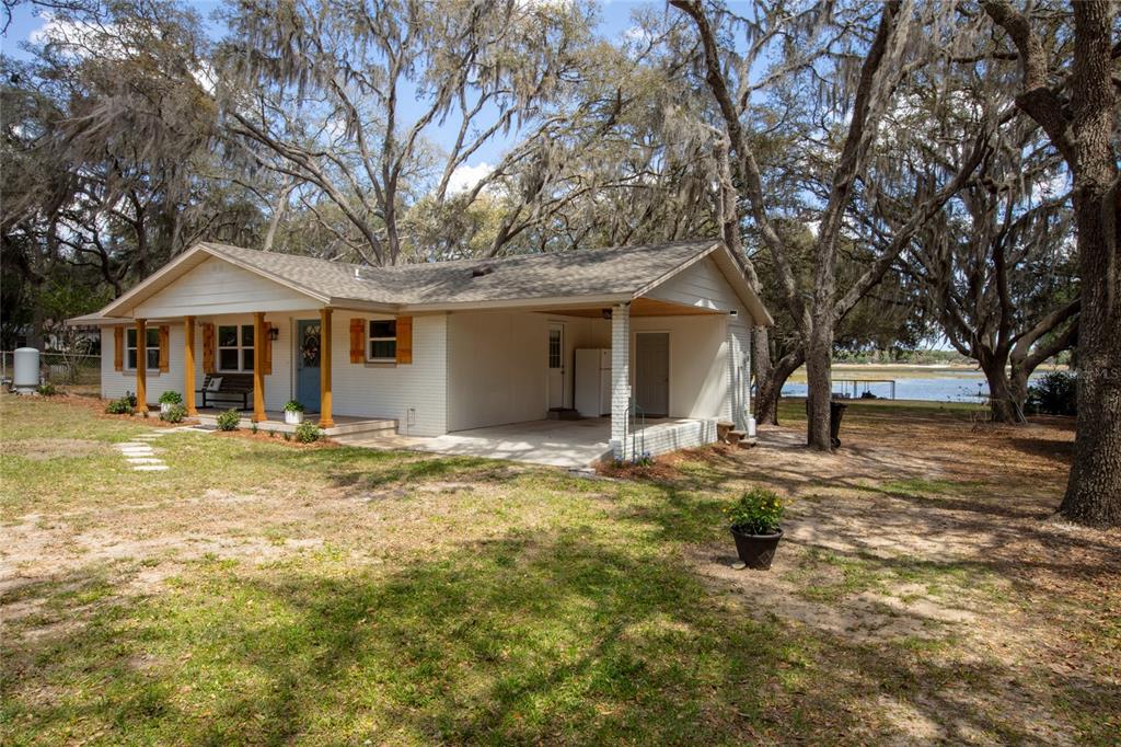 5921 County Road 352 Keystone Heights, FL 32656 - Photo 8 of 73 a front view of a house with a yard garage and tree