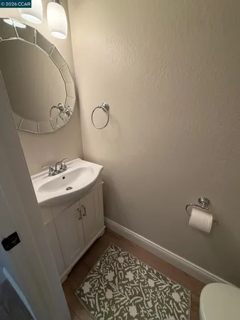 a bedroom with a bed and a night stand