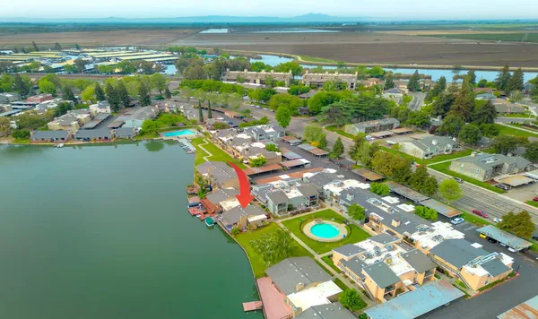 an aerial view of a house with a swimming pool