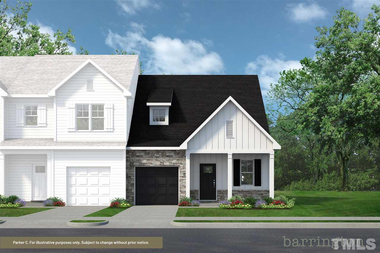 745 Riley Hill Road Zebulon, NC 27597 - Photo 1 of 3 a front view of a house with a yard and garage