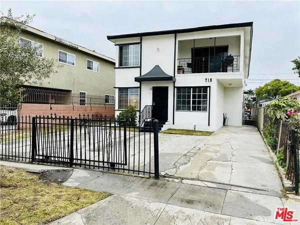 a front view of a house with garage