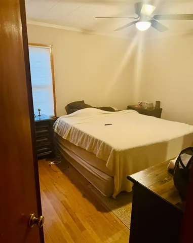 a bedroom with a bed and a dresser