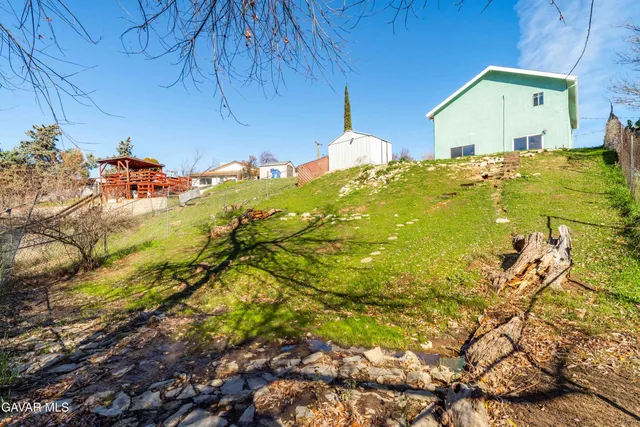 a view of swimming pool with a yard