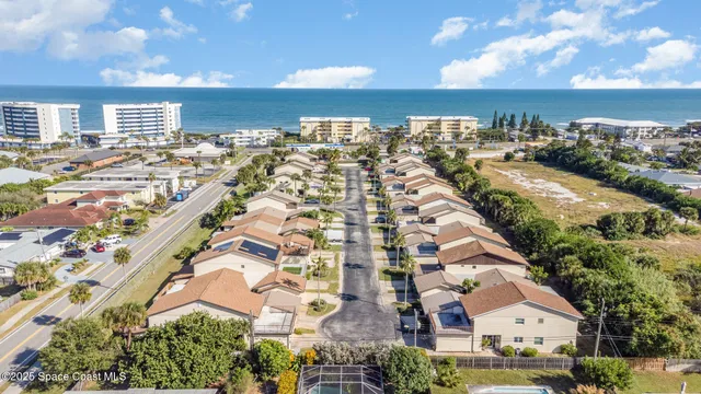 an aerial view of residential building with parking space