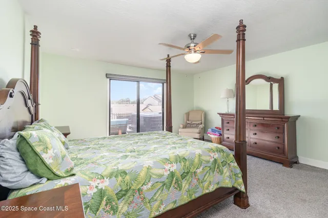 a bedroom with a bed dresser and a window