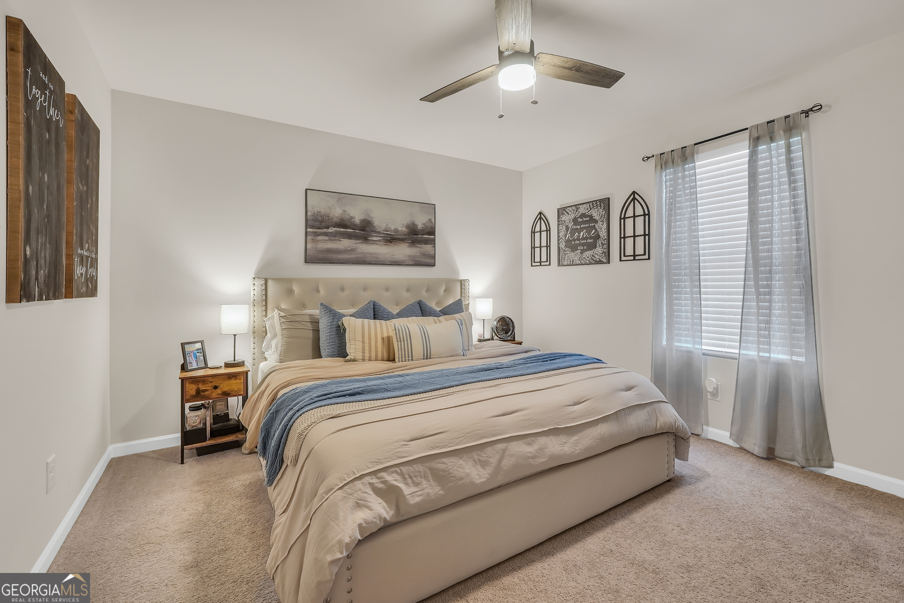 135 Catalpa Road Milner, GA 30257 - Photo 16 of 29 a bedroom with a bed and a window