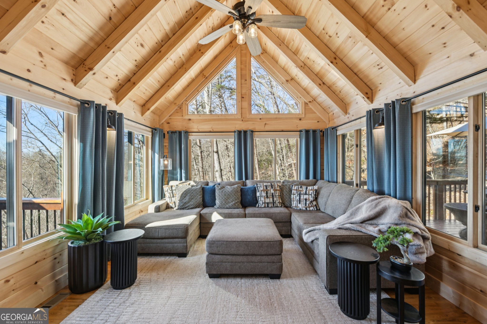 232 Ranch Mountain Drive Dahlonega, GA 30533 - Photo 15 of 78 a living room with furniture and floor to ceiling windows