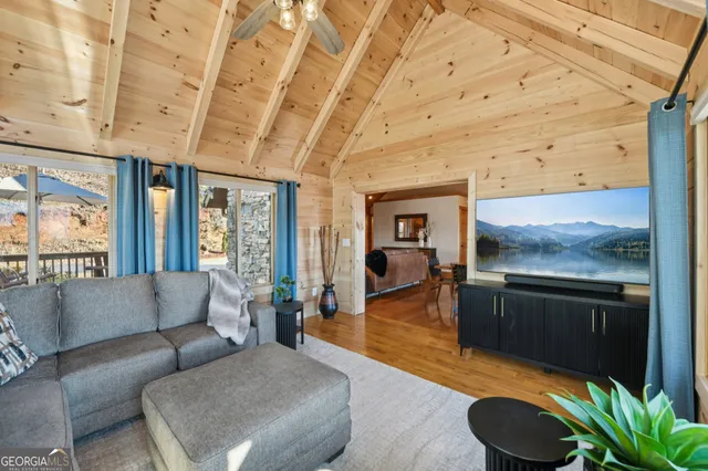 a kitchen with stainless steel appliances granite countertop a sink a stove and refrigerator