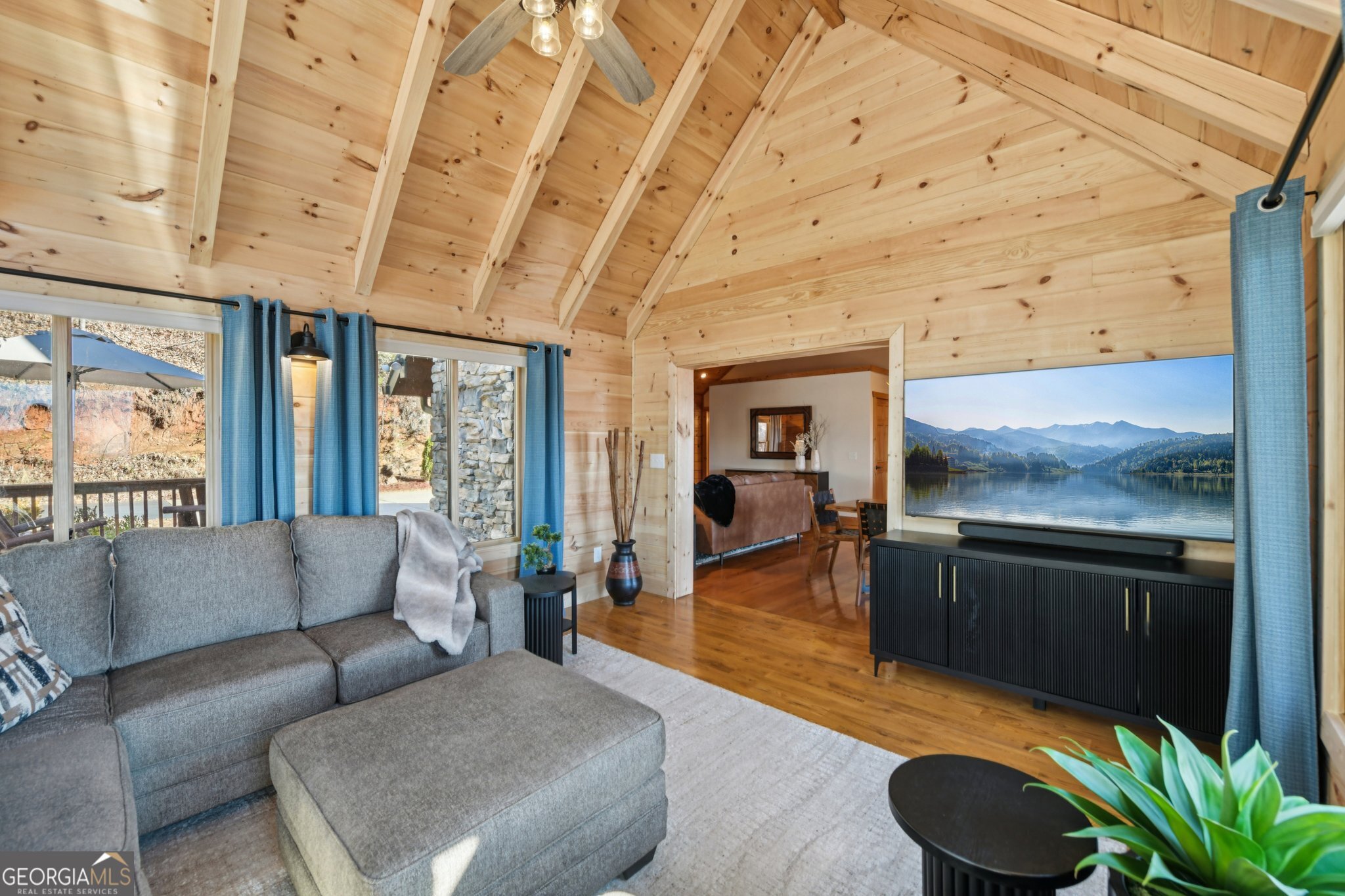 232 Ranch Mountain Drive Dahlonega, GA 30533 - Photo 16 of 78 a living room with furniture and a floor to ceiling window