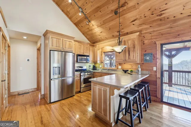 a kitchen with a sink and large window